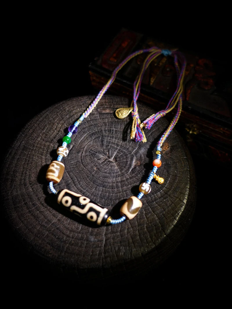 Necklace with beads on a dark surface
